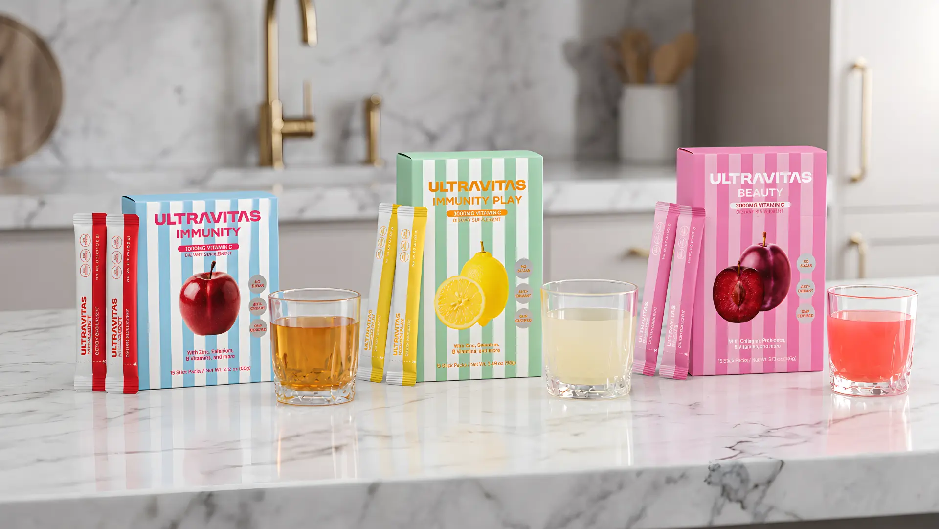 UltraVitas Immunity, Immunity Play, and Beauty ultra-dose vitamin C powder sticks with prepared drinks on a kitchen counter.